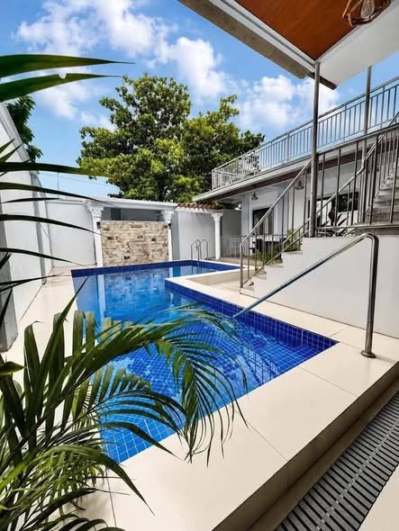 The private swimming pool and villa exterior