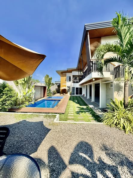 Villa exterior and landscaped poolside area